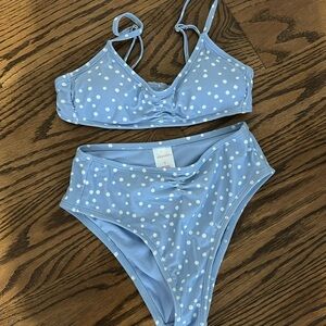 Blue and White polka dotted two-piece bikini set with high waisted bottoms